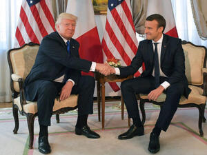 Firm handshake for U.S. President Trump and French President Macron. (AFP/ File Photo)