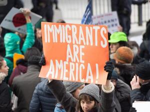 Protesters gather at JFK International Airport's Terminal 4 to demonstrate against President Donald Trump's executive order in New York. (AFP)