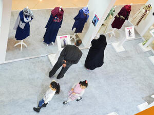 A couple is looking at clothes in Islamic fashion exhibition. (Sutterstock/File)