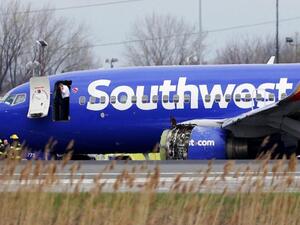 The Southwest Airlines jet sitting on the runway at Philadelphia International Airport after it was forced to land with an engine failure. (AFP/ File Photo)