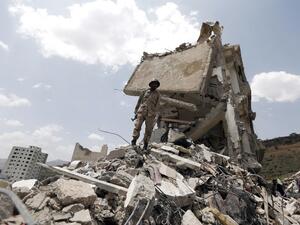 A building destroyed after a Saudi-led airstrike on Yemen's capital Sanaa (AFP)