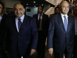 Adel Abdul Mahdi (2nd L) and Barham Saleh (2nd R) left the parliament chamber together. (AFP/File)