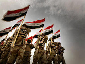 Iraqi army recruits parade during a graduation ceremony near Baghdad. [Getty Images]
