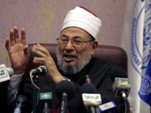 The well-known cleric faces trial in absentia in Egypt over charges of  "agreement, incitement and assistance to commit intentional murder, helping prisoners to escape, arson, vandalism and theft," according to Interpol. (AFP/File)