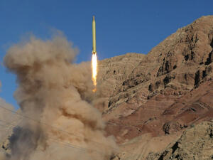  Iran launches a medium-range ballistic missile in the Alborz mountains (AFP/File Photo)