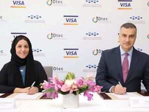 Shahla Abdulrazak and Ihab Ayoub signing the agreement