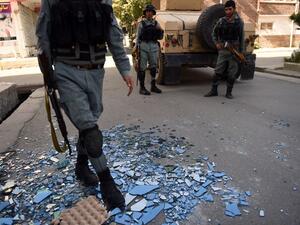 Afghan security forces outside the site of an attack on Care International in Kabul on September 6, 2016. (AFP/Walik Kohsar)