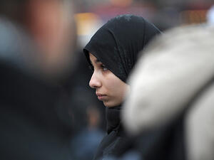 "Some of my close friends have had to choose between taking off their hijabs and feeling safe or keeping them on and becoming a target of bigotry," writes Hiba Ibrahim.  (AFP/Bertrand Langlois)