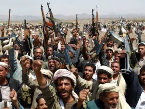 Houthi supporters brandishing their AK-47 machine guns, the weapon of choice for many gun buyers in Yemen. (AFP/File)