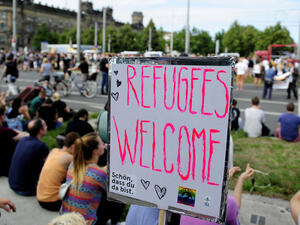 A sign reading "Refugees Welcome" is seen in Germany. Several German states have banned fireworks to avoid further traumatizing refugees. (AFP/File)