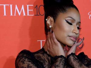 The 35-year-old Anaconda rapper appears to completely disrobe for the first portion of the video. (AFP/File)