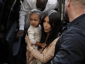 Kim Kardashian and Kanye West are expecting their third child via surrogate after the holidays. (AFP/File)