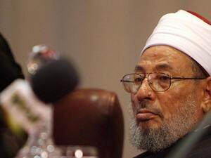The global police agency issued arrest warrant for Yousef al-Qaradawi in 2014 at request of Egypt’s post-coup regime. (AFP/File)