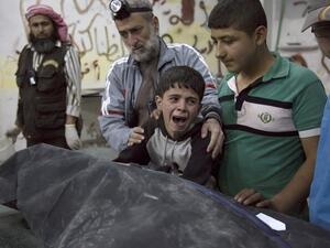A Syrian boy crying after the loss his family (AFP/File Photo)	