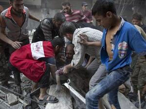 Victims are pulled from the rubble after a September airstrike in a rebel part of Aleppo (AFP/Karam al-Masri)