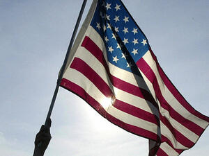 A man waves an American flag (AFP/File Photo)	
