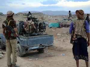 Armed Yemeni tribesmen from the Popular Resistance Committees, supporting forces loyal to Yemen's exiled government, monitor the area east of Sanaa following clashes with Shiite Houthi rebels on Sept. 12, 2015. (AFP/Abdullah Hassan)