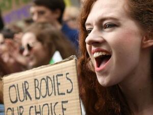 Protesters hold up placards during the March for Choice, calling for the legalisation of abortion in Ireland (AFP/File Photo)
