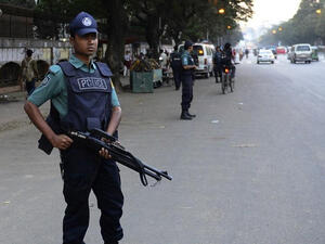 A police officer in Bangladesh watches over a busy street. (AFP/File)