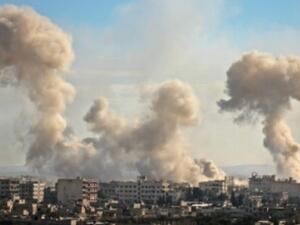 Smoke rises from buildings following bombardment  in the rebel-held besieged Eastern Ghouta (AFP/File Photo)
