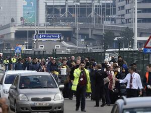 Passengers are evacuated from Brussels airport, on March 22, 2016 in Zaventem, after at least 13 people were killed and 35 injured as twin blasts rocked the main terminal of Brussels airport. (AFP/John Thys)