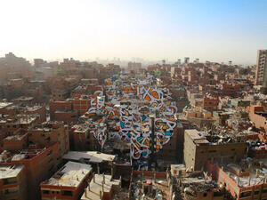 The French-Tunisian street artist eL Seed's latest work is a massive mural covering more than 40 buildings in Cairo's Garbage City. (Instagram)