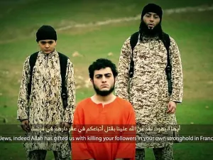 In the Daesh video the child shoots an Arab-Israeli accused of spying for Israel (File-AFP)