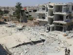 The Syrian town of Deraa, which has seen intensified shelling and aerial bombardment, is just a few kilometers away from Jordan's border town of Ramtha. (AFP/File)