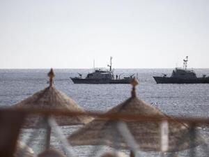 Egyptian navy vessels patrol off the coast of the Red Sea resort city of Sharm el-Sheikh on Feb. 17, 2011. (AFP/Marco Longari)