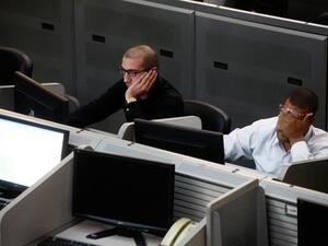 Traders working at the Egyptian stock exchange in Cairo. (AFP) Traders working at the Egyptian stock exchange in Cairo. (AFP)