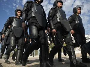 Egyptian riot policemen deploy to disperse supporters of Muslim Brotherhood ousted President Mohamed Morsi outside the police academy in Cairo on Wednesday, when the second hearing in his murder trial was to take place. (AFP/File)
