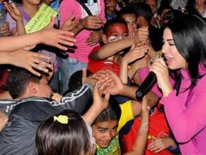 Marwa singing for orphans
