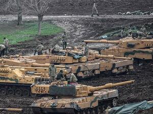 Turkish tanks are parked near the Syrian border at the Hassa district in Hatay province on Jan. 24, 2018, as part of the so-called Operation Olive Branch in Syria (AFP)