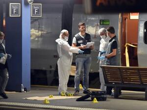 Officials inspect the train following the attack. (AFP/Philippe Huguen)