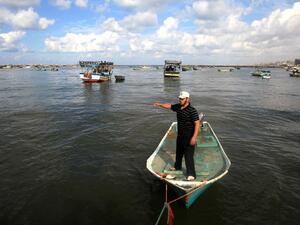 A Palestinian fisherman stands in his boat in the port of Gaza on the Mediterranean coast in Gaza City. (AFP/File)