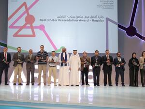 Dr Nabeel Al Salem, Executive Director of Outreach and Communications at QF R&D presents the Best Regular Poster Presentation Awards