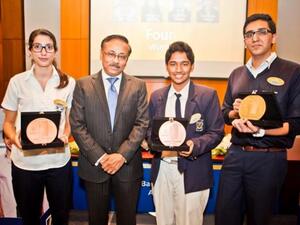 Winners of Emirates NBD Banker for a Day online competition with senior officials from the bank