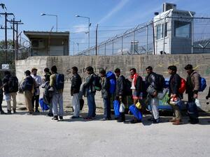 Migrants from Pakistan wait to enter Moria camp for migrants and refugees on the Greek island of Lesbos on March 21, 2016. (AFP/Stringer)