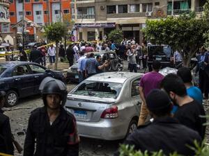 Egyptian security forces stand guard at the site of a bomb that targeted the convoy of the Egyptian state prosecutor, Hisham Barakat, in the capital Cairo on June 29, 2015. (AFP/File)