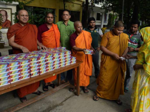 Buddhist monks in Bangladesh give out Iftar meals to Muslims at a shrine in Dhaka in 2015. (PHOTO: AFP)