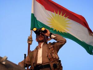 A Kurdish Peshmerga fighter holds a position on the front line in the Gwer district, 40 kilometers south of Erbil. (Photo: AFP)