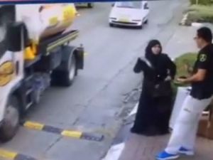 A screenshot from a video showing a Palestinian woman attacking an Israeli policeman in the West Bank in November.