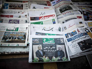 Iranian newspapers with pictures depicting Iranian and US leaders.  Iranians hope international sanctions that have suffocated the economy could be lifted if relations improve between Tehran and Washington. (Image credit: AFP)