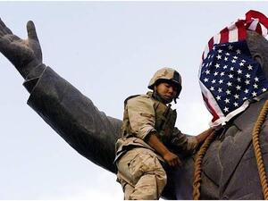 العصائب هددت بضرب القوات الأمريكية في حال لم تخرج