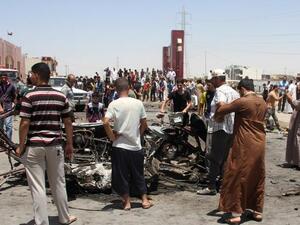  Iraqis inspect the site of a suicide car bomb attack in the Al-Haq square in Samarra, a predominantly Sunni town north of Baghdad, on July 5 (AFP image used for illustrative purposes)