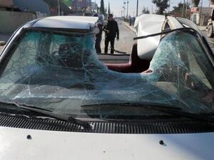 The roof of vehicle is partially destroyed following of a suicide car bomb that detonated outside a central police station in the northern Iraqi city of Kirkuk earlier this month. [AFP]
