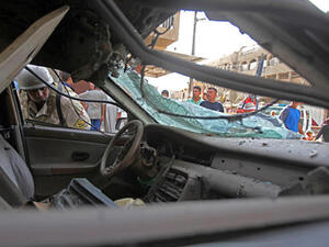 Post suicide car bomb at Iraqi checkpoint. [csmonitor]
