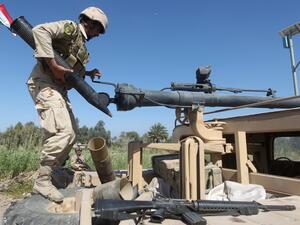 Iraqi forces prepare to fire on Daesh positions in the Garma district, west of the Iraqi capital Baghdad. (AFP/AHMAD AL-RUBAYE)