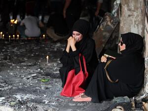 Iraqi women mourn the Karada suicide attack, days before another attack killed almost two dozen north of Baghdad. (AFP/Ahmad al-Rubaye)