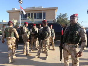 Iraqi army soldiers stand before a conference on fighting Daesh attended by Iraq's tribal leaders, militiamen and members of the government, at the Al-Asad air base, in Iraq's mainly Sunni Anbar province. (AFP/File)